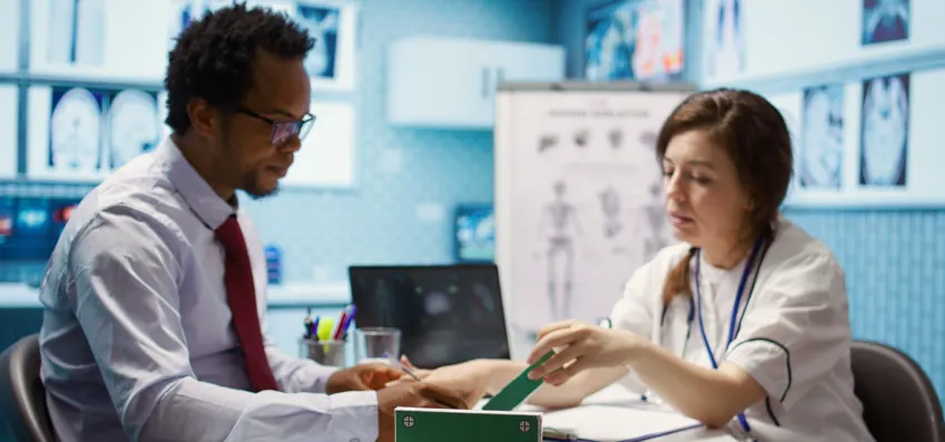 Woman Physician Offering Prescription Medicine